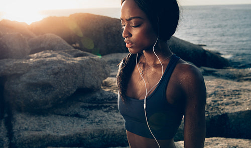 Tired woman taking break after intense workout