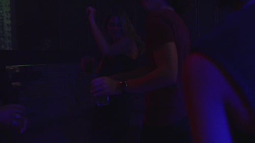 Group of friends dancing at the nightclub