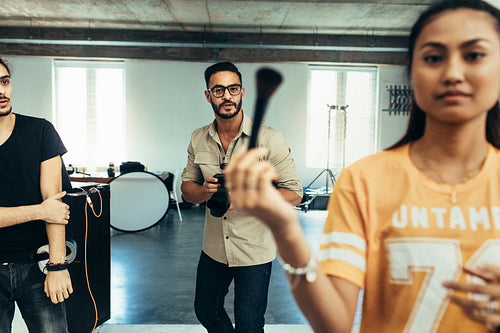 Team of photographers in a studio during a photo shoot