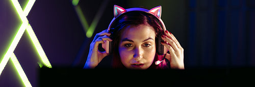 Gaming all night: Woman playing esports on a computer