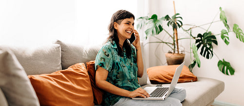Female freelancer working from her couch
