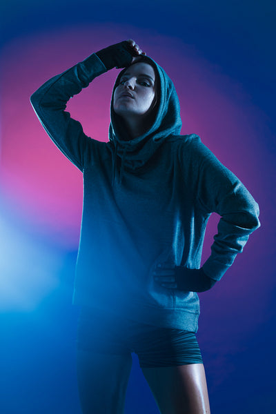 Sporty woman on colored background