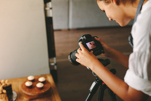 Woman taking photos for her food blog