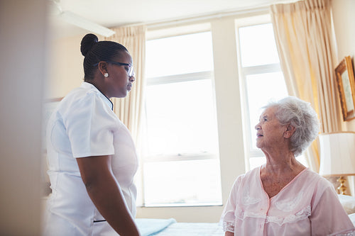 Female doctor visiting  patient for routine checkup