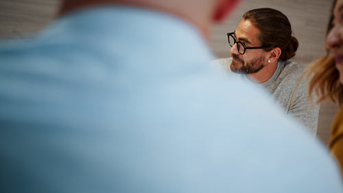 Happy design professionals having a team meeting in an office