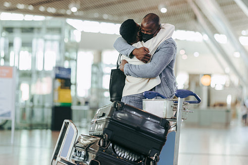Separated couple meeting at airport terminal