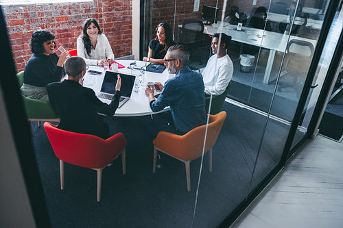 Businesswoman leading a meeting in a modern workplace