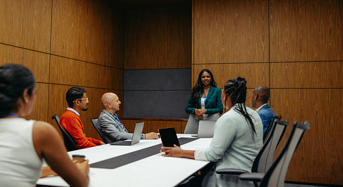 Professional boardroom meeting at a law firm with diverse team