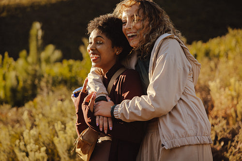 Friends laughing together in nature