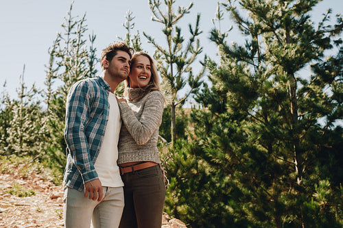 Couple admiring a view while hiking