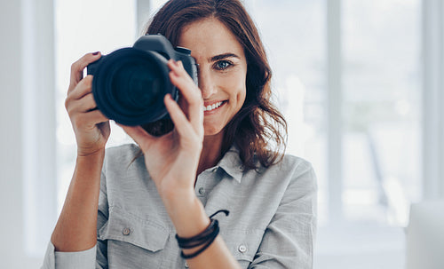 Photographer shooting with professional camera