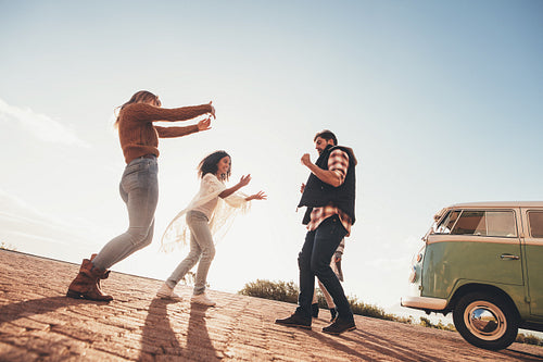 Group of friends having fun together on roadtrip