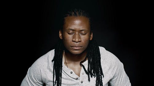 African man with his eyes closed