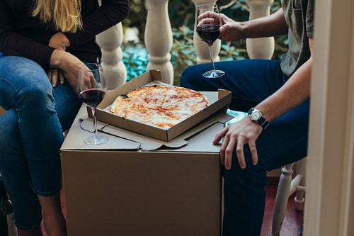 Couple enjoying food and wine at home