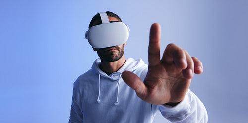 Man touching a button in virtual space