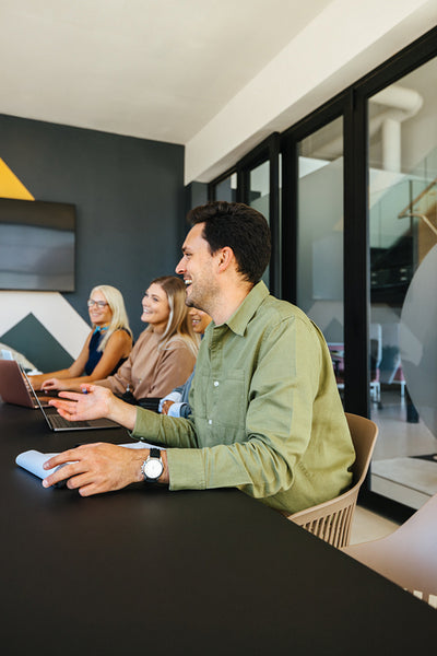 Group of young professionals discussing ideas during a boardroom meeting
