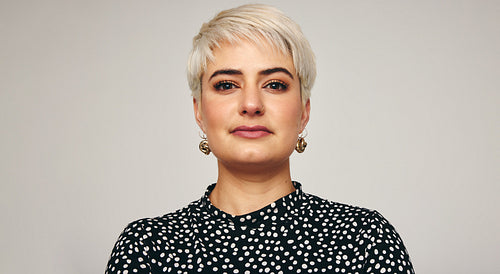 Portrait of a blonde woman in a studio