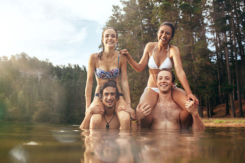 Happy young couples enjoying a day at the lake