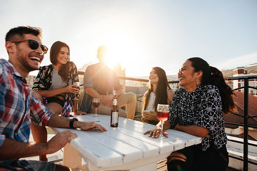 Happy young people having a rooftop party