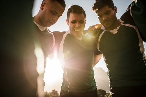 Rugby team in huddle