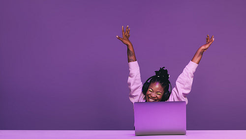 Female gamer celebrating winning an online video game