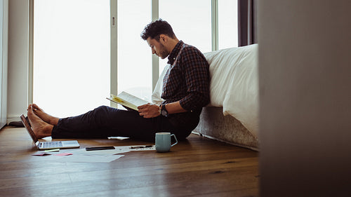Male working from home on the floor