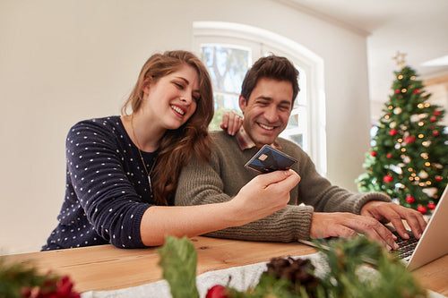Couple doing online shopping for christmas