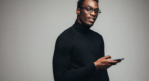 Handsome african man with a smart phone