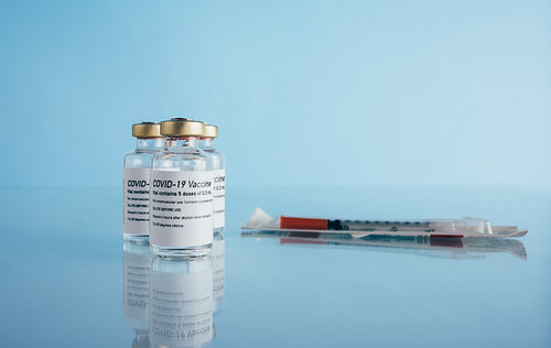 Corona virus vaccine vials and syringe