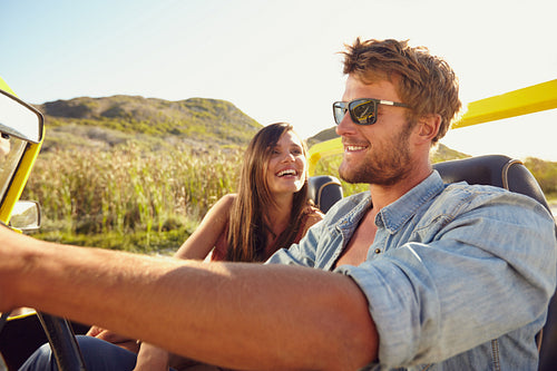 Cheerful young couple on a road trip
