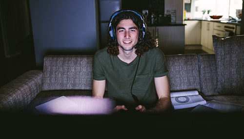 Man sitting at home and playing video game