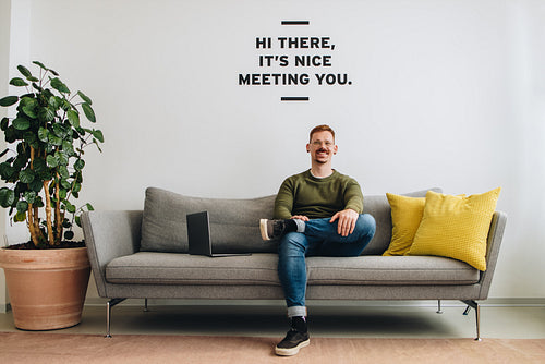 Successful male entrepreneur sitting sofa at lobby