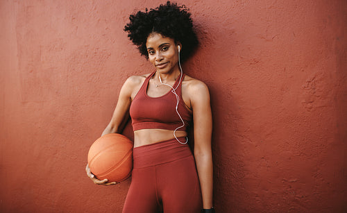 Woman relaxing after basketball practice
