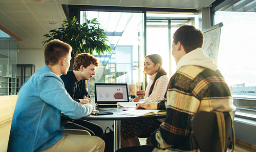 Group of students working on college presentation