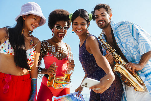 Friends celebrating Brazilian carnival at beach party