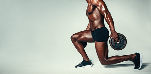 Muscular man working out with heavy weight