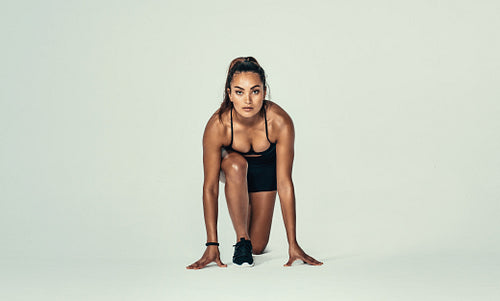 Young woman in a start position