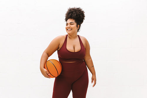 Fitness woman with basket ball