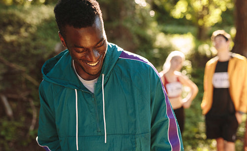 African sportsman smiling on mountain trail