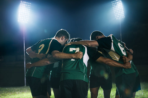 Rugby team in huddle after match
