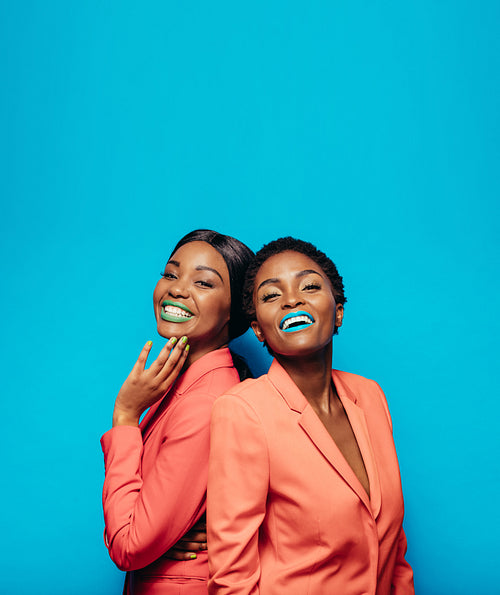 Female friends in fashionable clothing