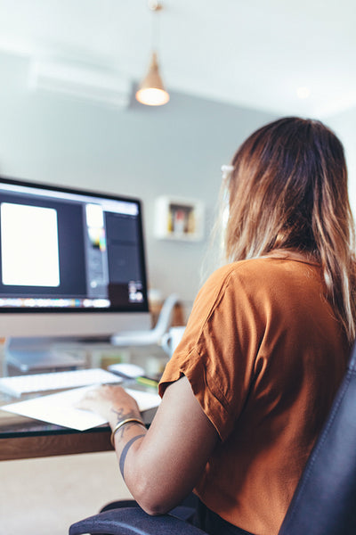 Artist working on computer at office