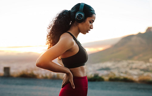 Fitness woman relaxing after a sprint