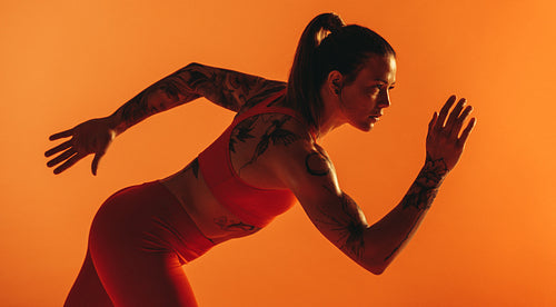 Fit woman on her mark for a sprint