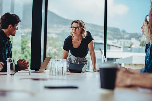 Businesswoman presenting her ideas to colleagues