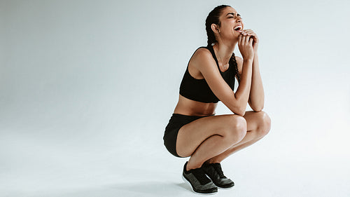 Sportswoman taking rest after workout