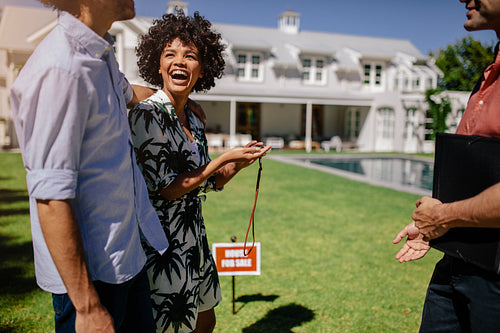 New house owners with real estate agent