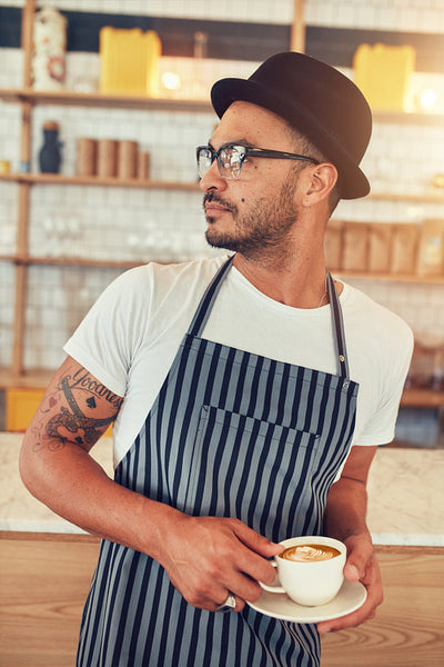 Young man working in coffee shop