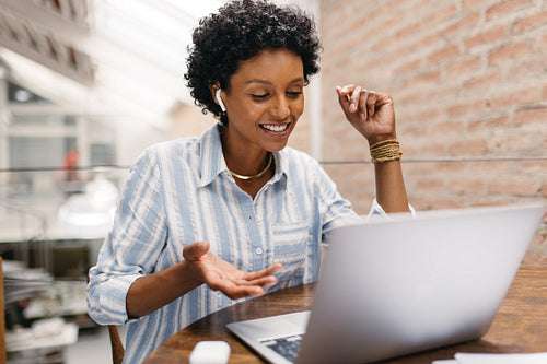 Young small business owner having a video call in a warehouse