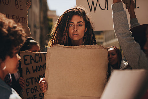 Group of female demonstrators on road with banners